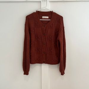 Rust knit Pilcro puff sleeve cardigan in size small. In great condition!